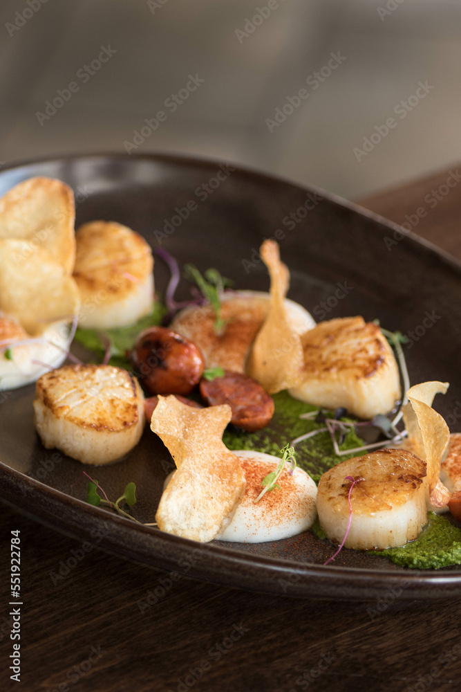 scallops on dish scallops on dish