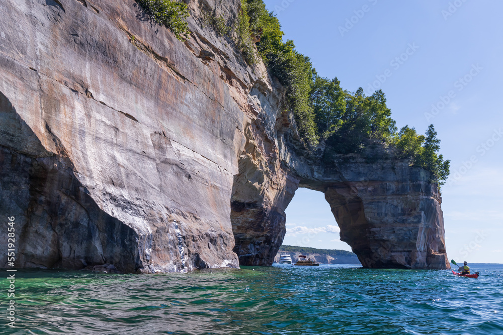 Boats and kayakers on Lover's Leap rock arch in Lake Superior at Pictured Rocks National Lakeshore, Upper Peninsula, Michigan, USA
