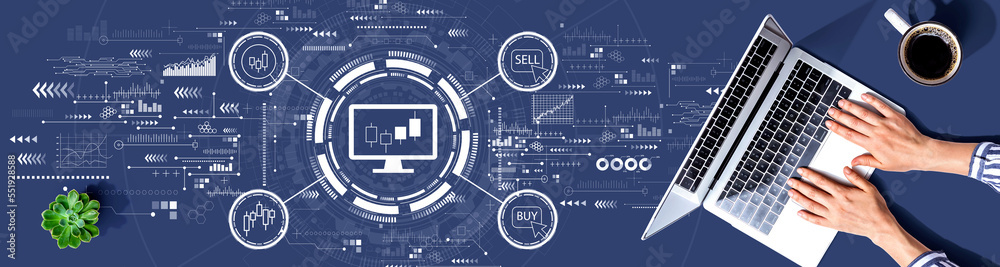 Stock trading theme with person using a laptop computer Stock trading theme with person using a laptop computer