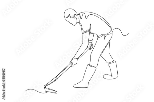 Continuous one line drawing gardener working soil with hoe in garden. Farmer digging with hand tool. Agriculture concept. Single line draw design vector graphic illustration. photo