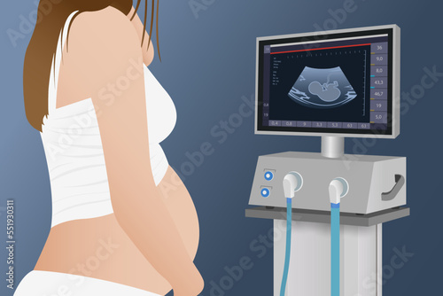 A cropped photo of a pregnant woman after an ultrasound, looks at the gender of the future baby on the monitor of the device 