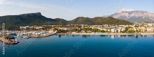 Fototapeta Naklejka Na Ścianę i Meble -  Panoramic photo of Kemer, resort town on Mediterranean coast of Turkey. City on Turkish Riviera from above.