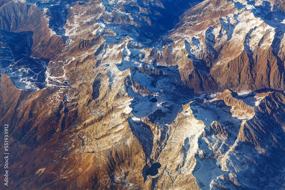 Snowy mountains view directly from above . Swiss Alps covered in snow