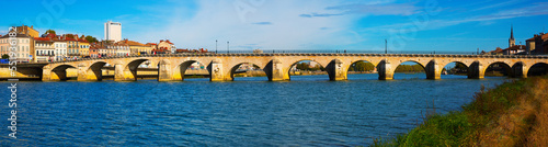 Panoramic view of old bridge over Saona and loire river in Macon, France