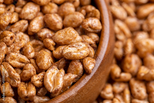 Grain wheat covered with a thin layer of chocolate