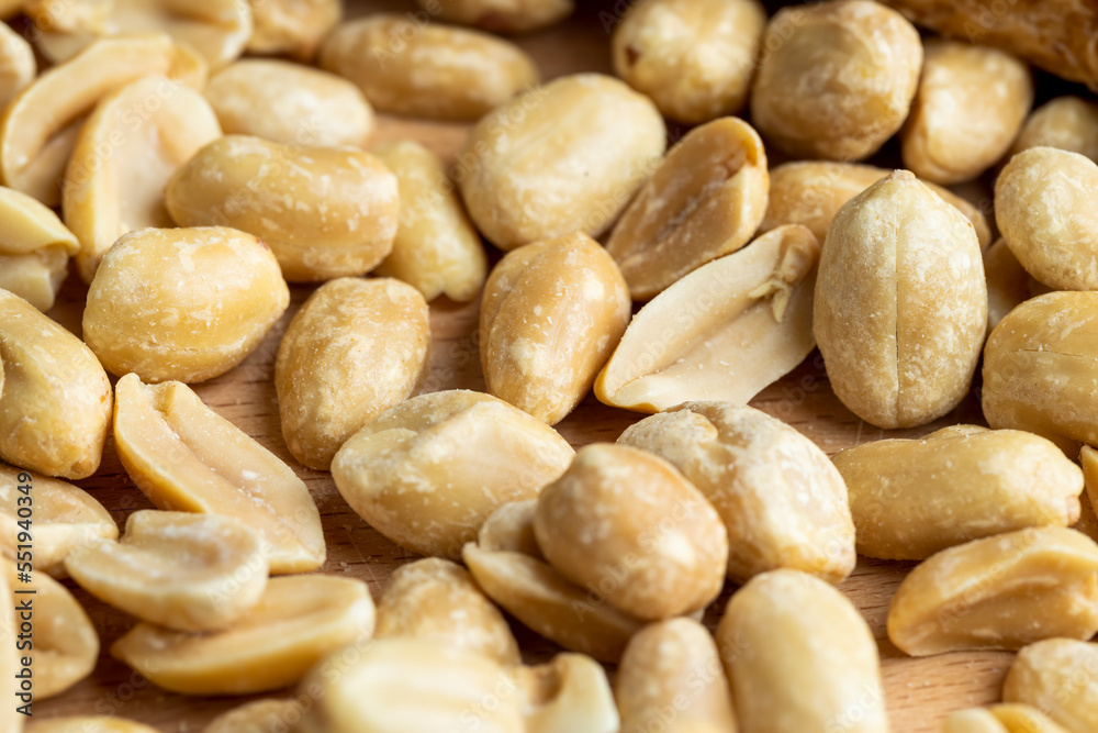 Peeled and roasted peanuts on the table Peeled and roasted peanuts on the table