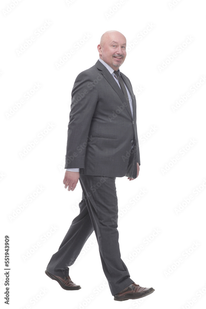 Mature business man striding forward .isolated on a white background. Mature business man striding forward .isolated on a white background.