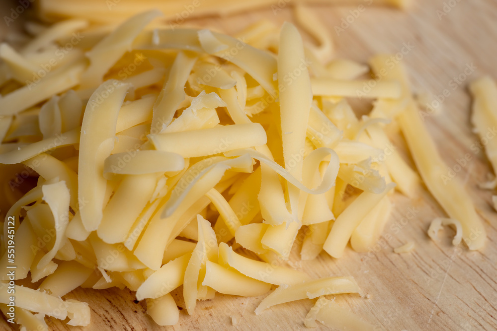 Sliced and grated hard cheese with cashew nuts Sliced and grated hard cheese with cashew nuts