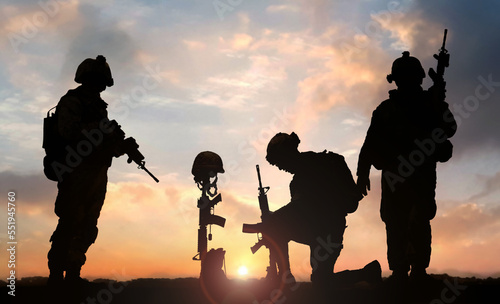 3D illustration of a military man kneeling in front of Fallen Soldier grave during sunset