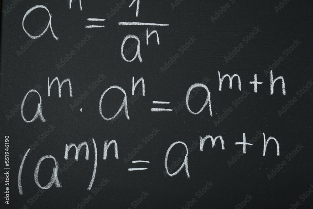 Many different math formulas written on chalkboard, closeup Many different math formulas written on chalkboard, closeup