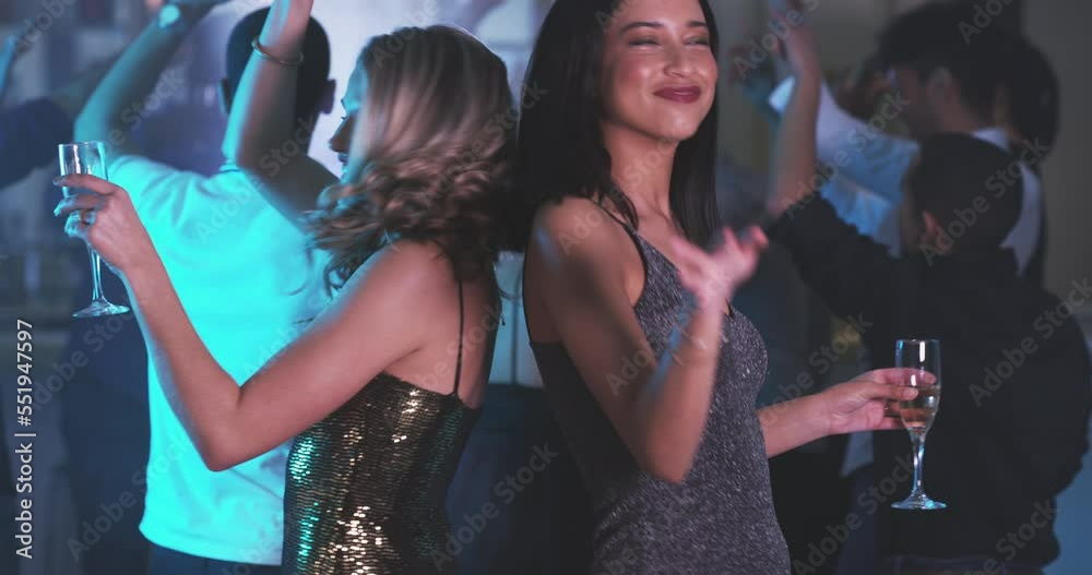 Girl friends, party and dancing with drinks for happy hour, new years or social celebration. Champagne, dance and women with a smile happy about music, disco event and rave with cocktails and lights