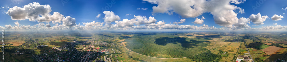 Aerial view from high altitude of earth covered with white puffy cumulus clouds on sunny day Aerial view from high altitude of earth covered with white puffy cumulus clouds on sunny day