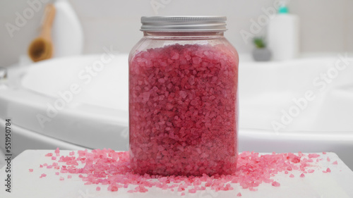 Jar with bath salt on table in bathroom, closeup