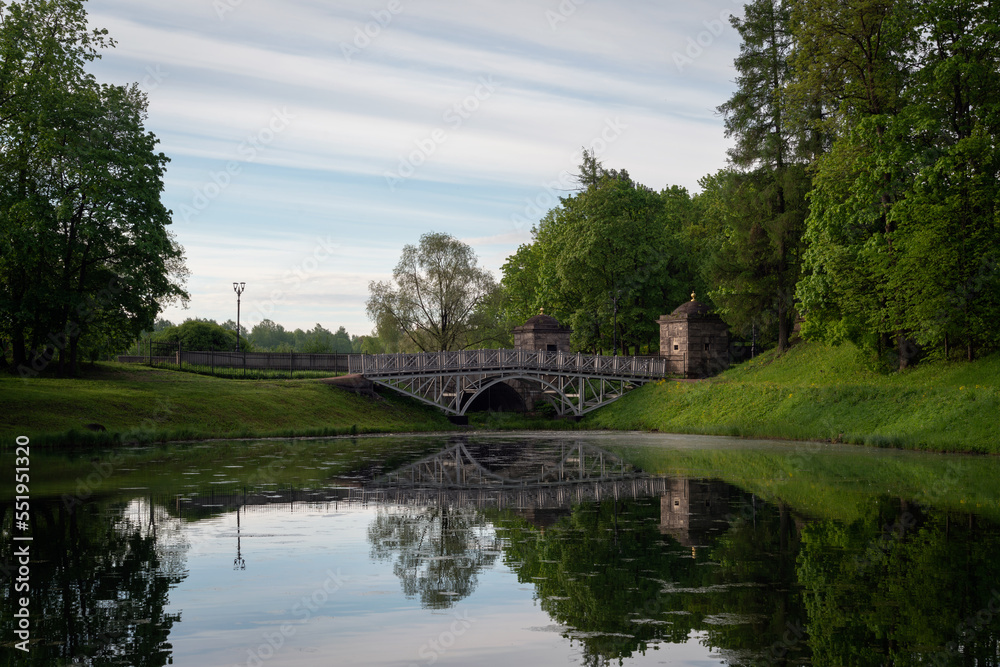 View of the White Lake in Gatchina Park and the stone bridge at the Konetable Square on a sunny summer day, Gatchina, Leningrad region, Russia