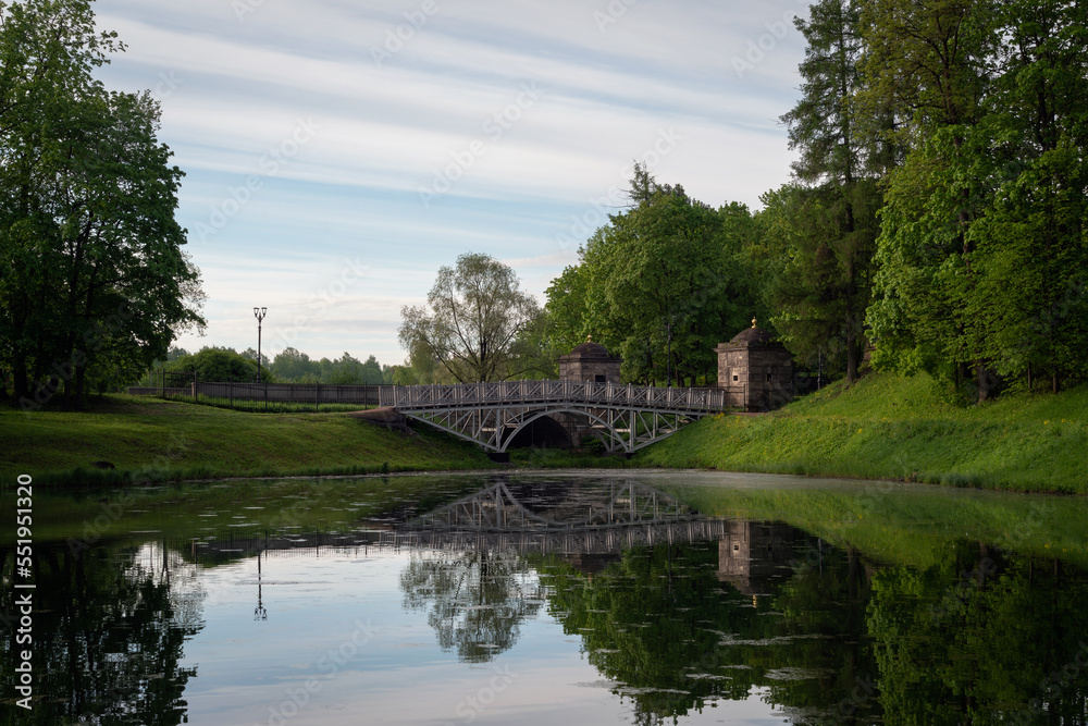 View of the White Lake in Gatchina Park and the stone bridge at the Konetable Square on a sunny summer day, Gatchina, Leningrad region, Russia View of the White Lake in Gatchina Park and the stone bridge at the Konetable Square on a sunny summer day, Gatchina, Leningrad region, Russia