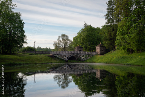 View of the White Lake in Gatchina Park and the stone bridge at the Konetable Square on a sunny summer day, Gatchina, Leningrad region, Russia © Ula Ulachka