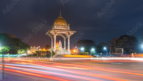 Statue of Chamarajendra Wadiyar illuminated in night time in Mysore city, India. photo