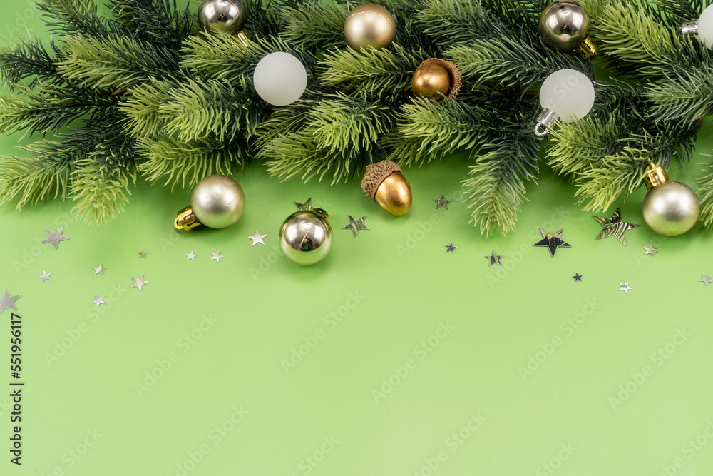 Fototapeta premium Christmas Decorations with stars confetti on green background. Holiday pattern background.