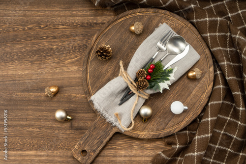 Festive dinner table setting spoon, fork knife, christmas decorations. Christmas concept.