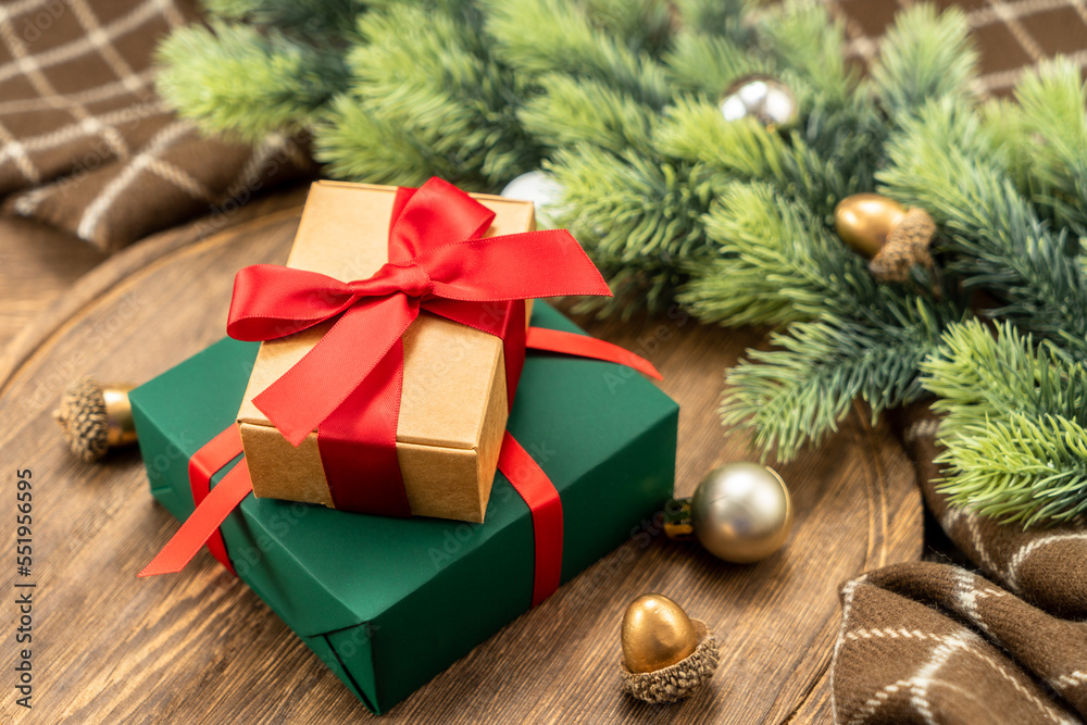 Christmas present on wooden cutting board with Christmas decorations. Christmas present on wooden cutting board with Christmas decorations.