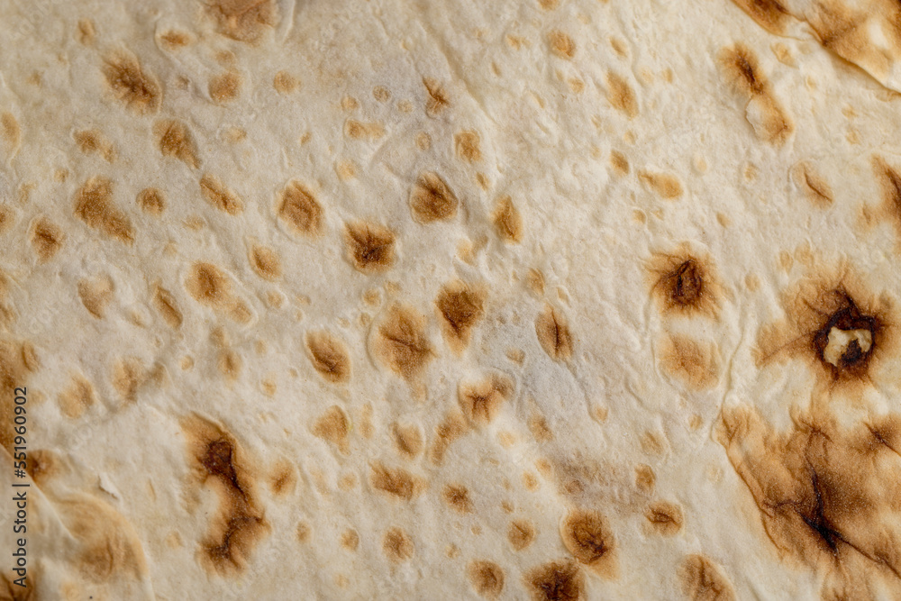 Wheat pita bread with dark spots