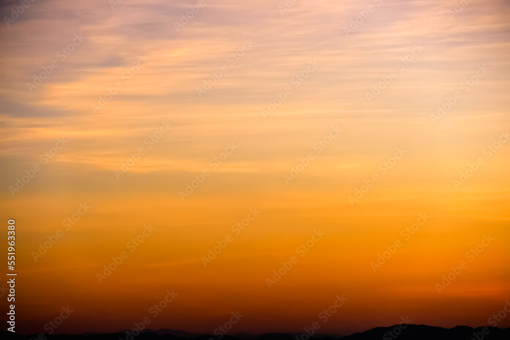 ฺBeautiful orange gold sky before sunrise over mountains view background ฺBeautiful orange gold sky before sunrise over mountains view background