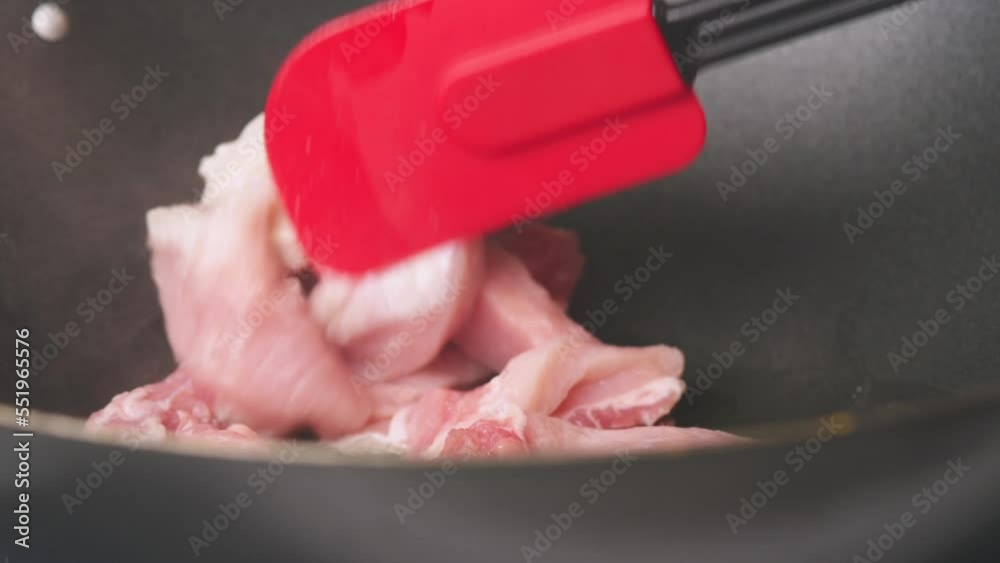 Video. The cook is frying pieces of chicken meat in a frying pan. Close-up. Turns appetizing pieces of meat with a spatula. Recipes for delicious healthy chicken dishes. Video. The cook is frying pieces of chicken meat in a frying pan. Close-up. Turns appetizing pieces of meat with a spatula. Recipes for delicious healthy chicken dishes.
