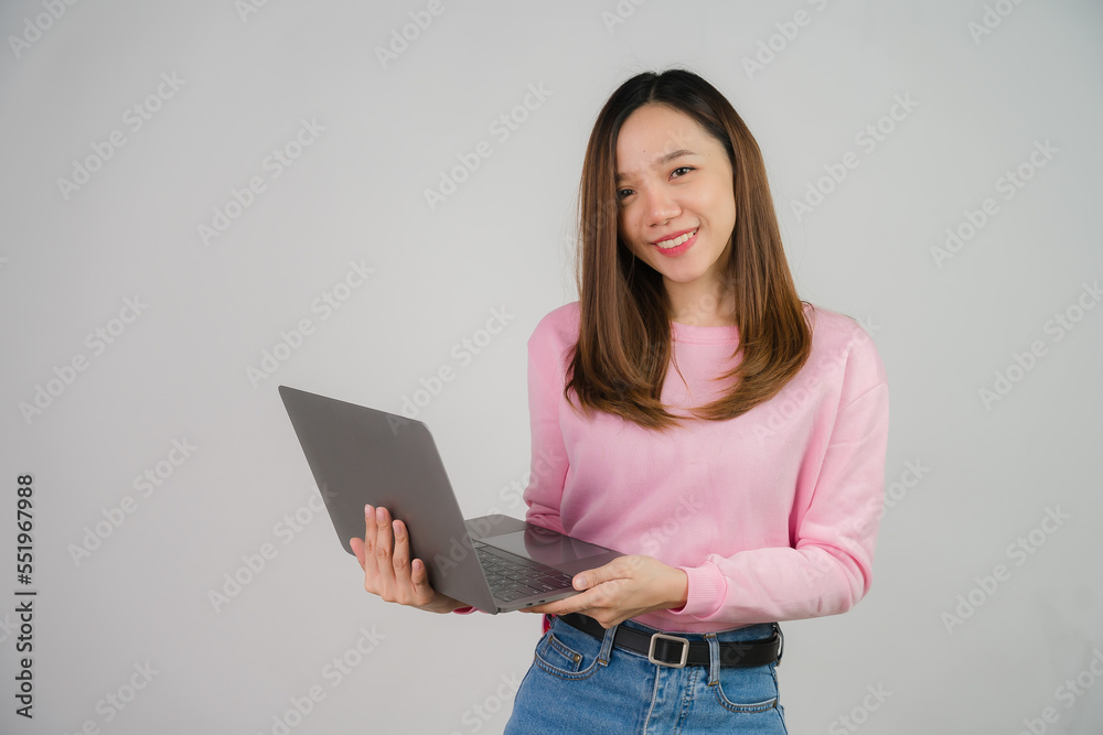 Asian girl holding laptop on white background Asian girl holding laptop on white background