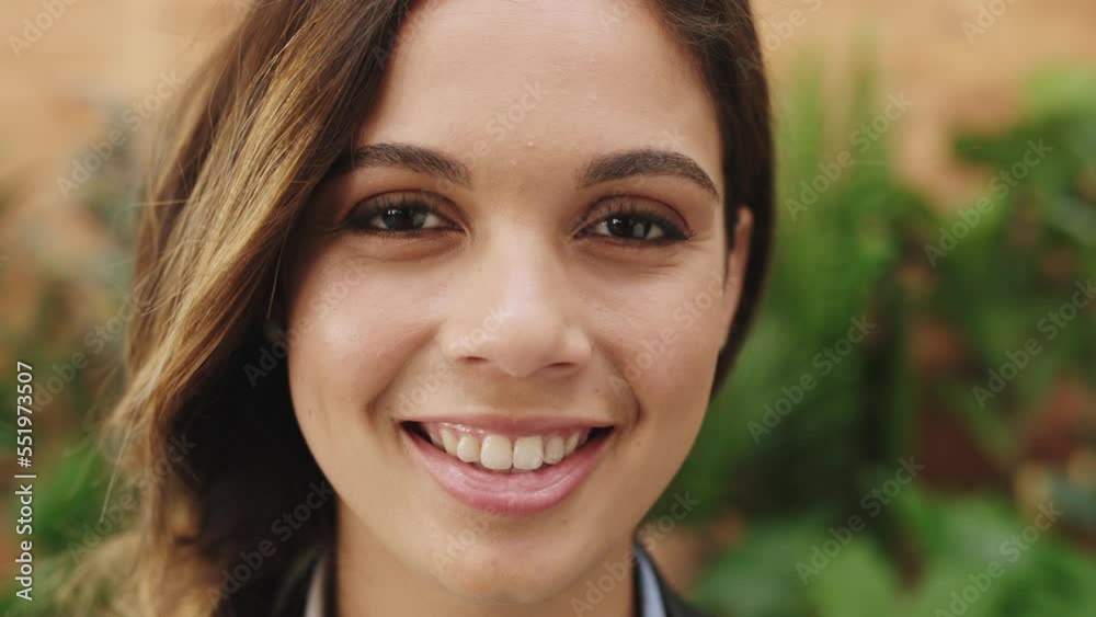 Woman, face and smile with a green plant background for carbon neutral environment with a positive mindset, vision and goal for future. Portrait of female model or student happy while outdoor Woman, face and smile with a green plant background for carbon neutral environment with a positive mindset, vision and goal for future. Portrait of female model or student happy while outdoor