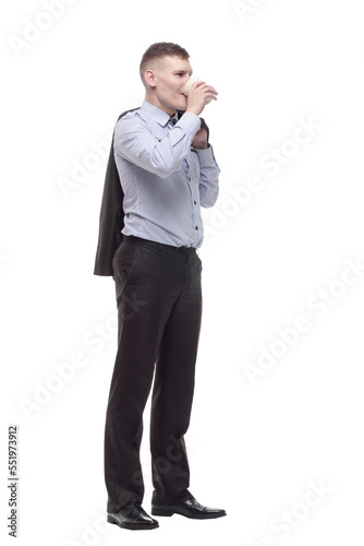 smiling young businessman with a takeaway coffee