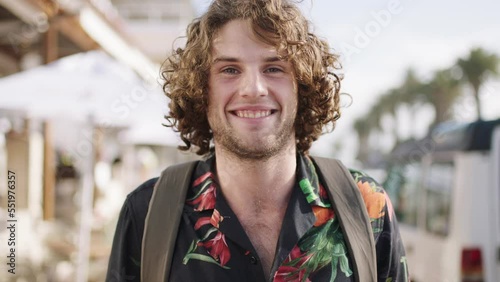 City, happy and face of man on travel tour of Miami Florida for USA holiday, vacation wellness or student gap year. Global adventure, world journey and portrait of gen z person walking in street road photo