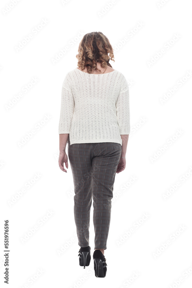 attractive young woman in a white jumper striding forward. attractive young woman in a white jumper striding forward.