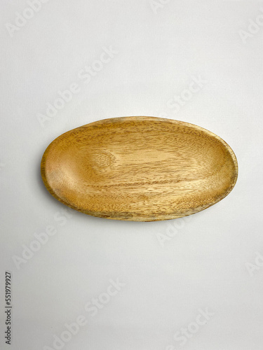 An empty wooden oval plate. photo