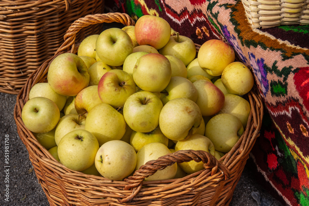 yellow apples in a wicker basket in Bistrita, Romania yellow apples in a wicker basket in Bistrita, Romania