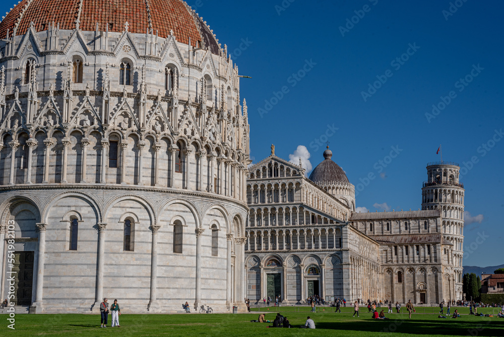 Low angle view of the baptistery, cathedral, Pisa tower and large group of people against  sky.