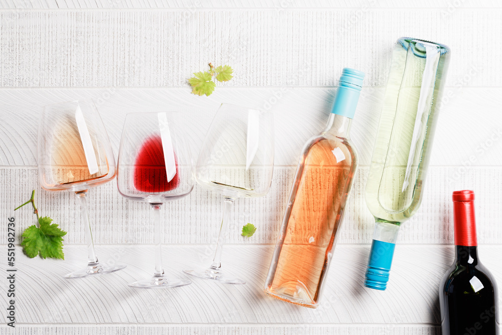 White, rose and red wine glasses and bottles
