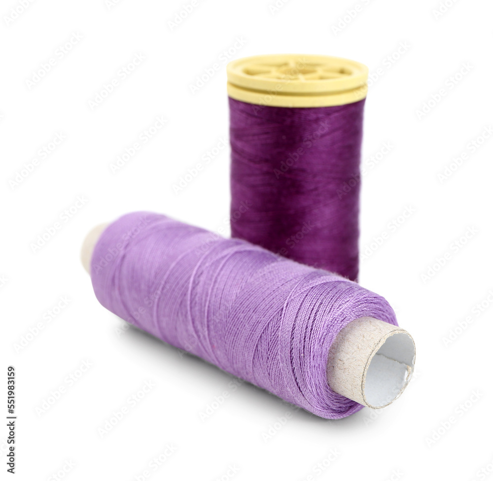 Colorful sewing thread spools on white background Colorful sewing thread spools on white background