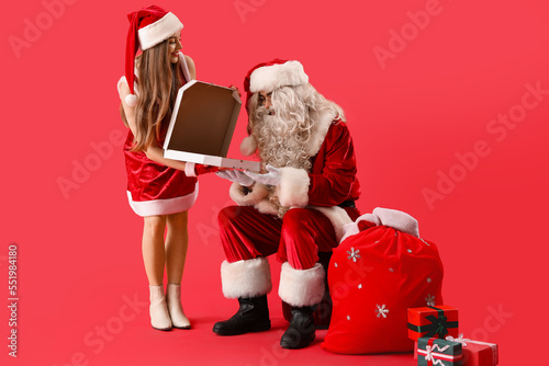 Young couple in Santa costu...
