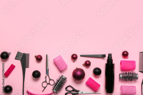 Fototapeta Naklejka Na Ścianę i Meble -  Hairdresser's tools with Christmas balls on pink background