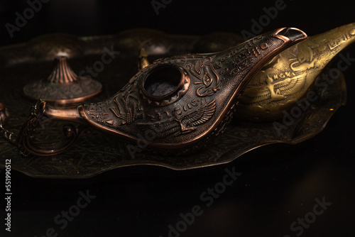 Aladdin's magic lamp isolated on black background