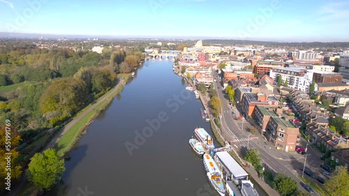 The drone aerial footage of Thames River runs through Kingston upon Thames and Hampton court park, Greater London.