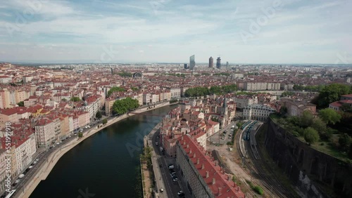 The drone aerial footage of River Saone runs through Lyon city, France. The Saône is a river in eastern France. It is a right tributary of the Rhône, rising at Vioménil in the Vosges department and jo