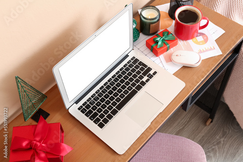 Laptop with Christmas prese...