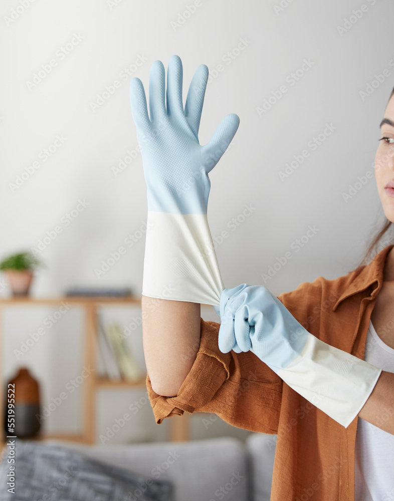 Fotka „Woman, hand gloves and prepare to start cleaning, hygiene and  housework in clean service, work and job in house. Female domestic worker,  bacteria and cleaning service, zoom and cleaner in home“ ze
