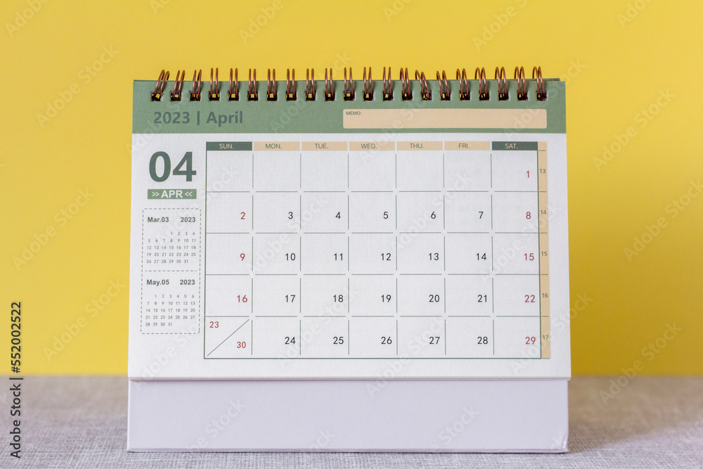 Hello April.Desktop calendar for April 2023 on the table. Hello April.Desktop calendar for April 2023 on the table.