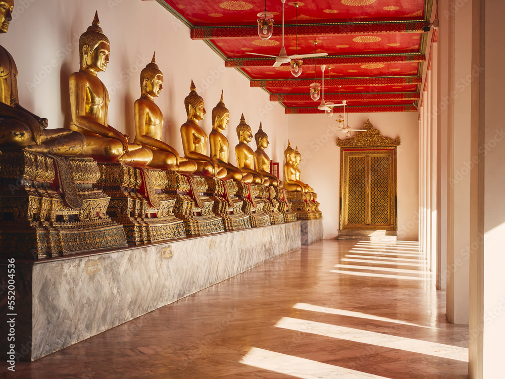 Fototapeta premium Golden Buddha Statue in row Thailand Temple Religion Antique collection