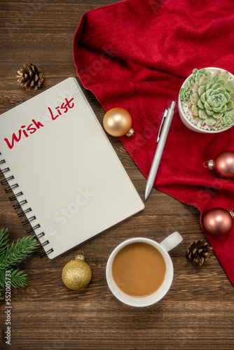 Notebook for wish list entries with Christmas decorations. Christmas mock up template. View from above