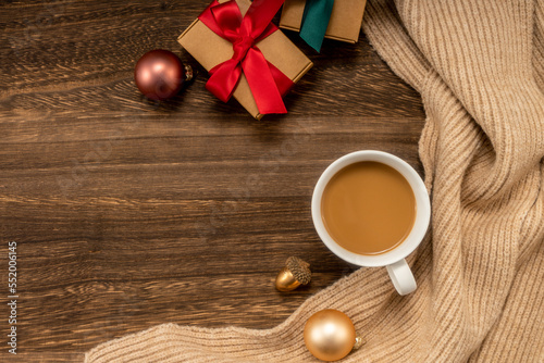 Christmas decorations and coffee on wooden background. christmas concept.