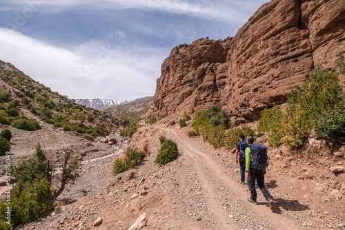 walkers on the road, Arous, Bougames valley, Atlas mountain range, morocco, africa