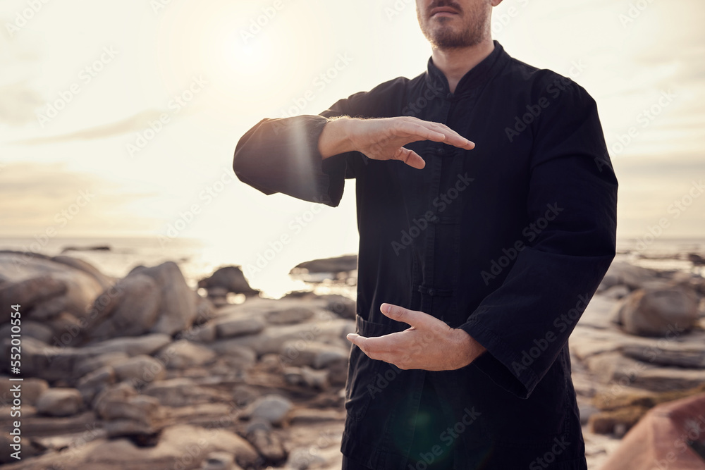 Φωτογραφία Health, fitness and tai chi with a man using martial arts for spiritual wellness and exercise by the beach